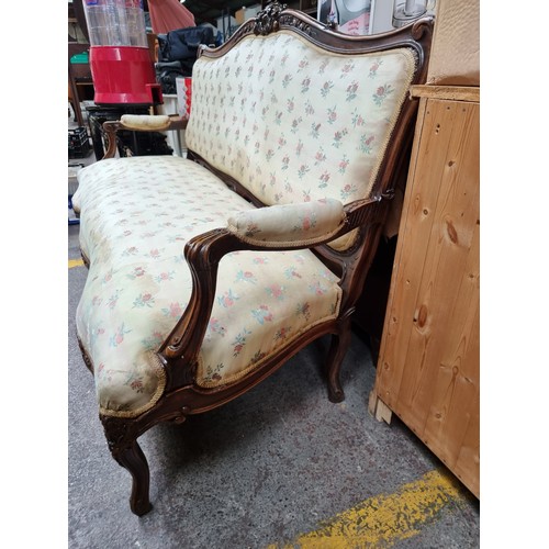 396 - Star Lot : A horse hair original Victorian three-seater sofa with intricate carved wooden detailing,... 