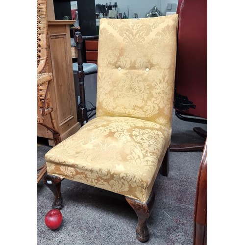 400 - A Victorian slipper chair with curved front legs and original seat fittings.