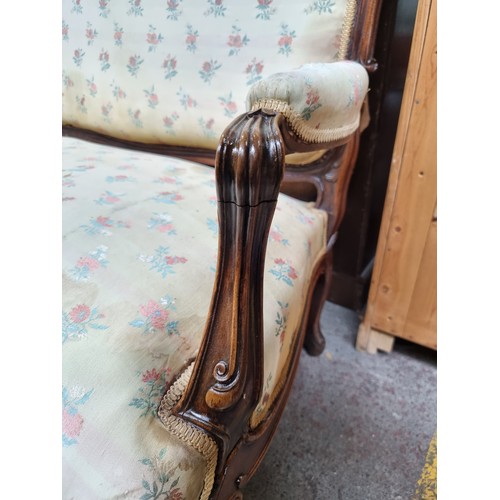 396 - Star Lot : A horse hair original Victorian three-seater sofa with intricate carved wooden detailing,... 