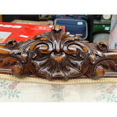 396 - Star Lot : A horse hair original Victorian three-seater sofa with intricate carved wooden detailing,... 