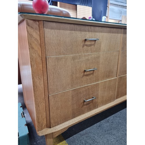 420 - A mid century  six drawer glass topped sideboard with gallery back. Birch construction with gallery ... 