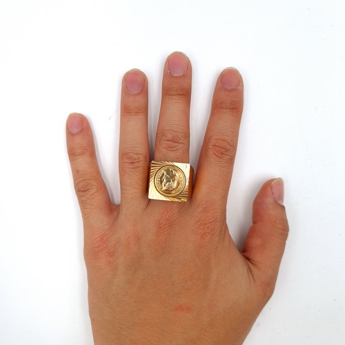 984 - A large Napoleon gents III portrait ring. Ring size X. there is marks on the outside of the band whi... 