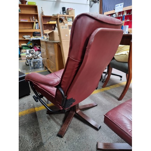 423 - Star Lot A vintage Mid Century genuine leather Danish reclining and swivel armchair and foot stool. ... 