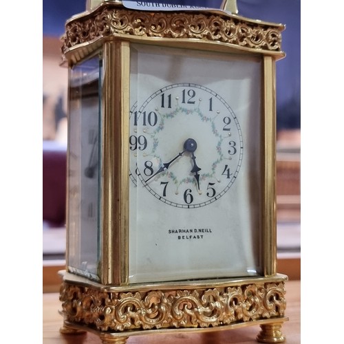 470 - Star Lot : A very attractive antique Edwardian carriage clock made by Sharman D. Neill Belfast. Feat... 