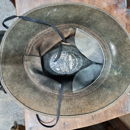 734 - A genuine vintage leather Jackaroo  hat with braided detail to top and a Jackaroo pin. Size L Proven... 