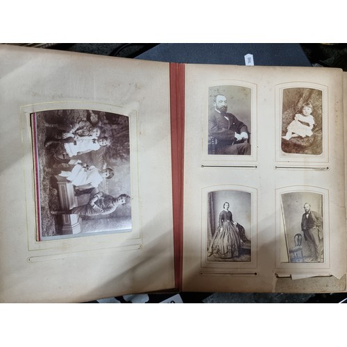 802 - Star Lot : A Victorian photo album containing 24 pages full of portraits. Held in a leather bound ha... 