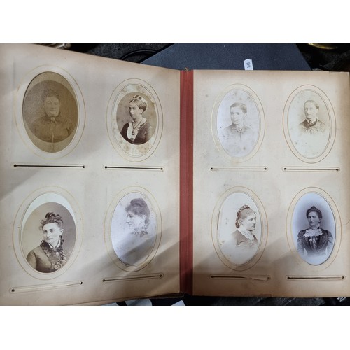 802 - Star Lot : A Victorian photo album containing 24 pages full of portraits. Held in a leather bound ha... 