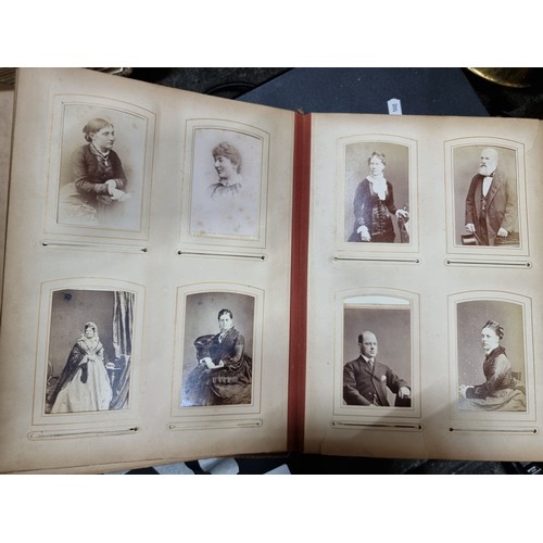 802 - Star Lot : A Victorian photo album containing 24 pages full of portraits. Held in a leather bound ha... 