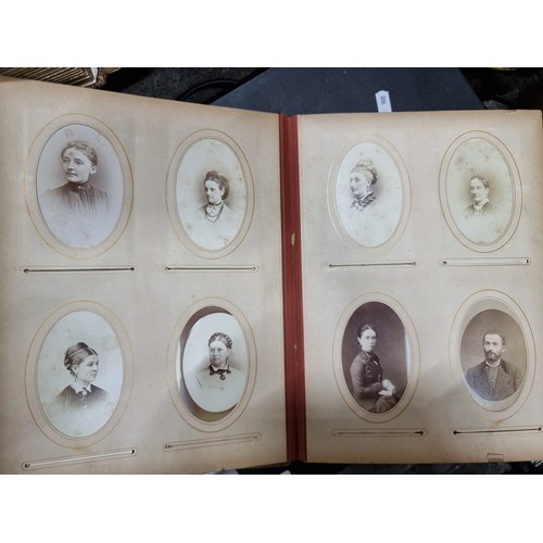 802 - Star Lot : A Victorian photo album containing 24 pages full of portraits. Held in a leather bound ha... 