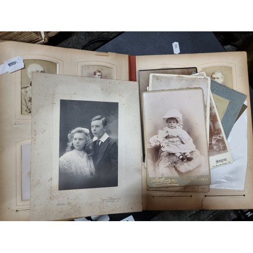 802 - Star Lot : A Victorian photo album containing 24 pages full of portraits. Held in a leather bound ha... 