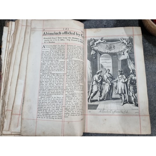 808 - Star Lot: A large antique book titled 'The History of the Old and New Testament' published and print... 