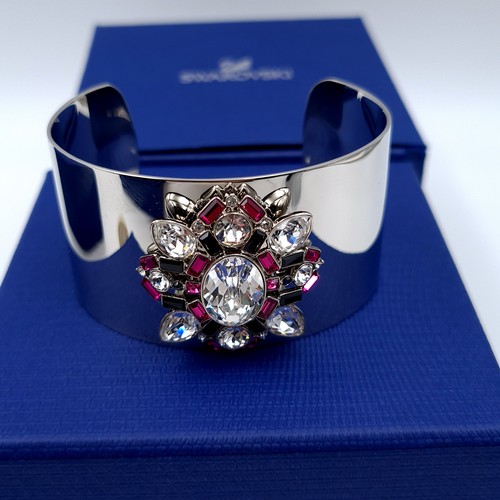 50 - Two items by Swarovski. Including a striking jewelled cuff bracelet. Together with a gem further gem... 