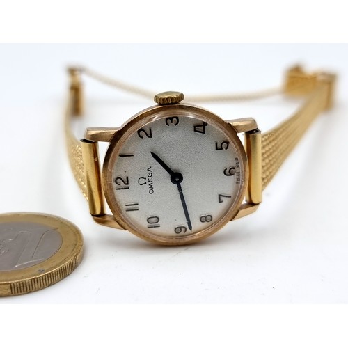 38 - Star Lot : A vintage ladies Omega vintage wrist watch, featuring a stainless steel gold mesh bracele... 