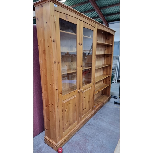 930 - Star Lot : A fantastic double shelving unit with a glass fronted cabinet with two doors revealing fi... 