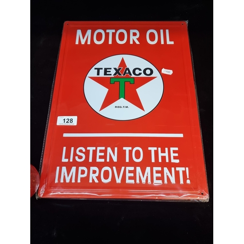 128 - A metal advertising plaque for Texaco motor oil with text in relief.