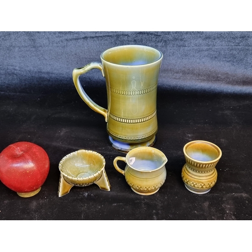 143 - Four vintage Wade Irish porcelain items including a jug, a neatly sized bowl on three feet, a bud va... 