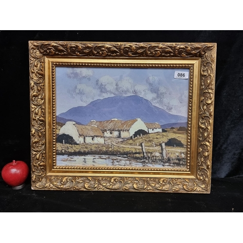 86 - A print of a painting originally by Paul Henry. Housed in an attractive gilt frame.