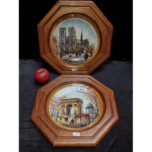 873 - Two framed Limoges plates by Louis Dali featuring 'Le Cathedrale Notre Dame' and 'L'arc de Triomphe'... 