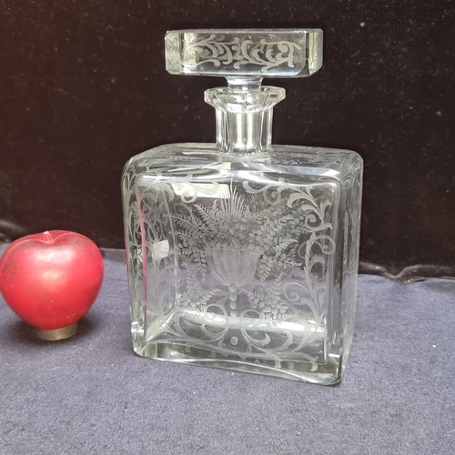 875 - A beautiful antique  glass decanter boasting an intricate etched floral design. With original stoppe... 