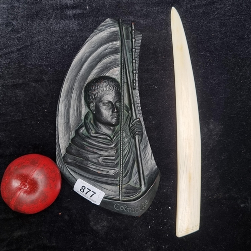 877 - Two interesting items including a beautiful bone letter opener and a carved plaque of St. Colmcille.