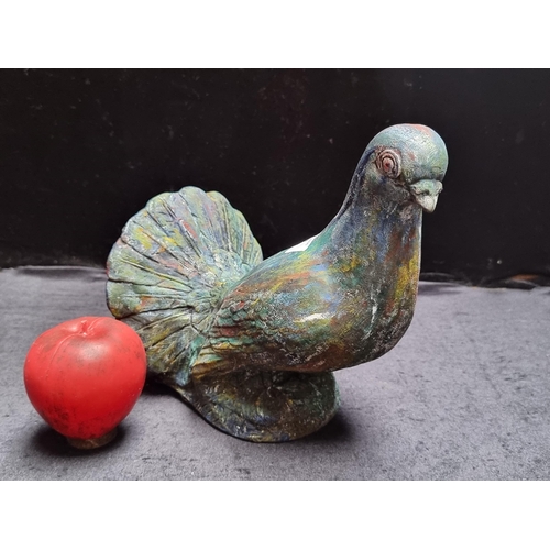 890 - A colourful plaster sculpture of a curious pigeon, hand painted in bright primary colours. Stamp to ... 