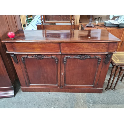 943 - Star Lot : A beautiful Victorian credenza with two drawers and a shelf in the cabinet space. Boastin... 