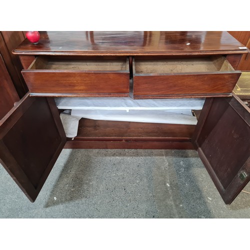 943 - Star Lot : A beautiful Victorian credenza with two drawers and a shelf in the cabinet space. Boastin... 