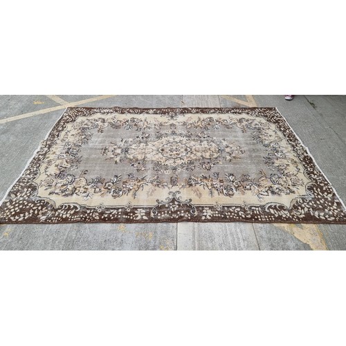 921 - Star Lot : A nice large, Vintage  hand made Handnotted Turkish wool on Cotton rug in shades of fawn,... 