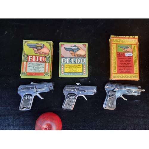 135 - Three vintage c. 1940s/1950s German made pellet toy revolvers with original boxes. From brands Filu,... 