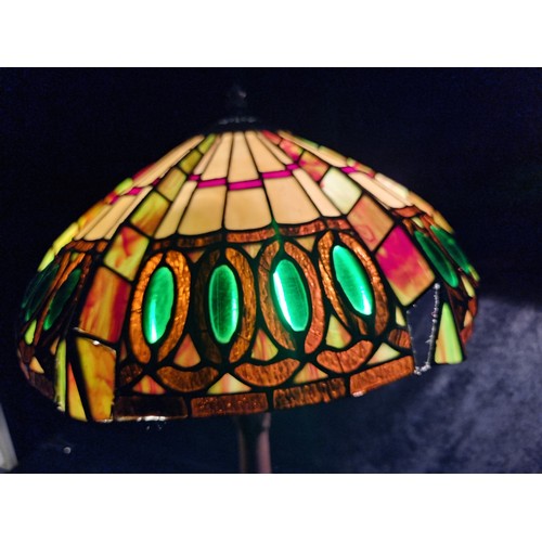 937 - A beautiful Tiffany style tale lamp with an intricate colourful glass shade. Fitted with a three-pro... 