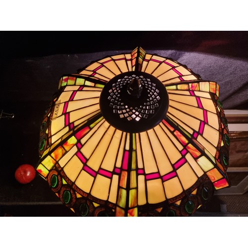 937 - A beautiful Tiffany style tale lamp with an intricate colourful glass shade. Fitted with a three-pro... 