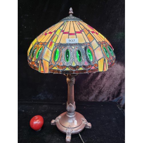 937 - A beautiful Tiffany style tale lamp with an intricate colourful glass shade. Fitted with a three-pro... 