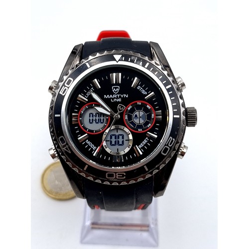 6 - A large heavy example of a sporty Martyn Line chronometer wrist watch, set with a black dial, red el... 