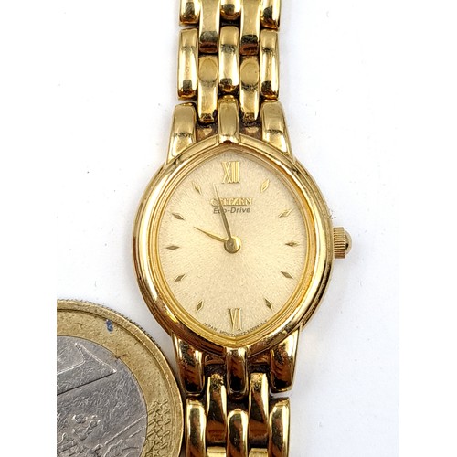 8 - An elegant example of a Citizen gold toned ladies wrist watch, featuring an oval white enamelled fac... 