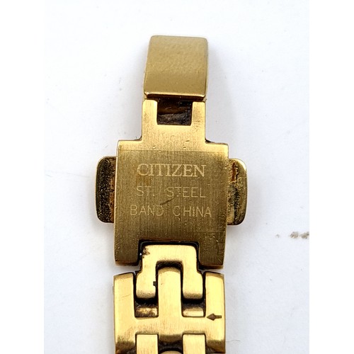 8 - An elegant example of a Citizen gold toned ladies wrist watch, featuring an oval white enamelled fac... 