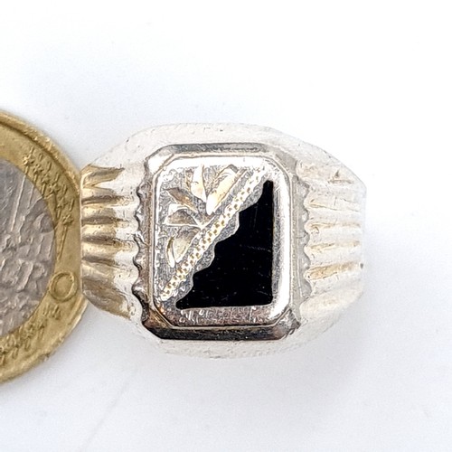 42 - A handsome sterling silver gents Signet ring, set with Onyx detail. Ring size: V. Weight: 6.37 grams... 