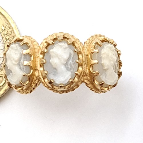 51 - Star Lot : A fabulous and unusual antique 9 carat gold (stamped 375) three stone Cameo ring. Ring si... 