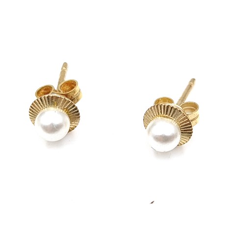 57 - A collection of six pairs of 9 carat gold stud earrings, including a beautiful pair set with White S... 