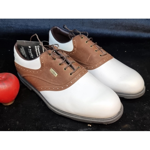 191 - A handsome pair of brand new Footjoy genuine leather golfing shoes with soft spikes to sole. In a br... 