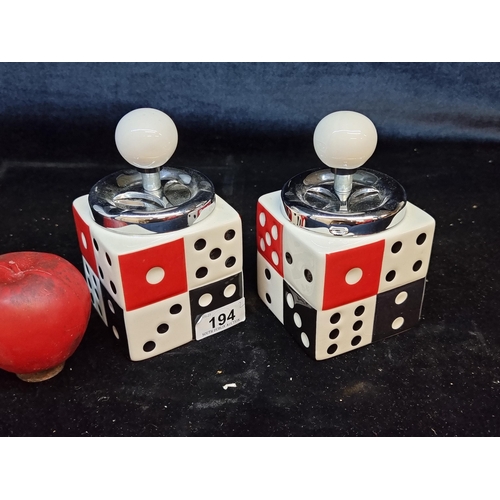 194 - Two new old stock vintage  fun ceramic ashtrays in the form of dice. With push mechanism to top.