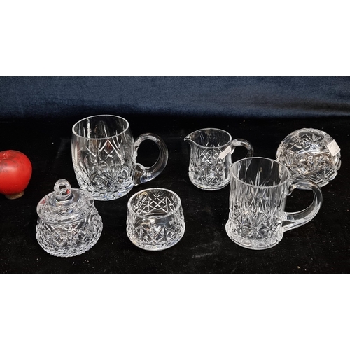 201 - Six crystal items including two steins, a round bud vase, sugar bowl and creamer. Inc Waterford.