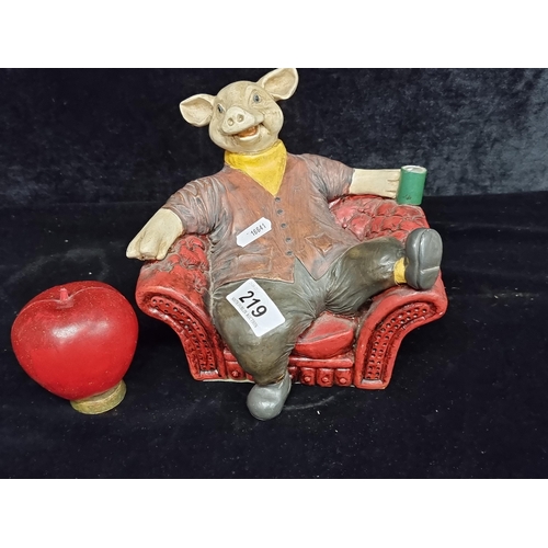 219 - A fabulous figure of a jolly pig sitting in his chesterfield armchair. By Originalities Ireland.