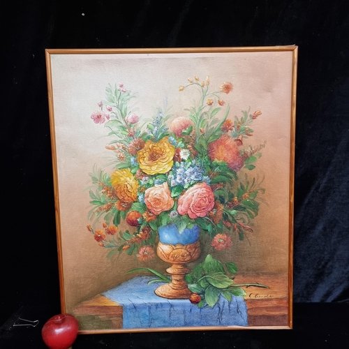 63 - An original acrylic on textured canvas painting showing a still life study of a bountiful floral arr... 