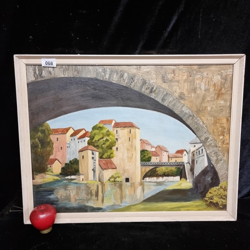 68 - An original vintage oil on board painting of the city of Mostar. Unsigned and housed in a cream fram... 