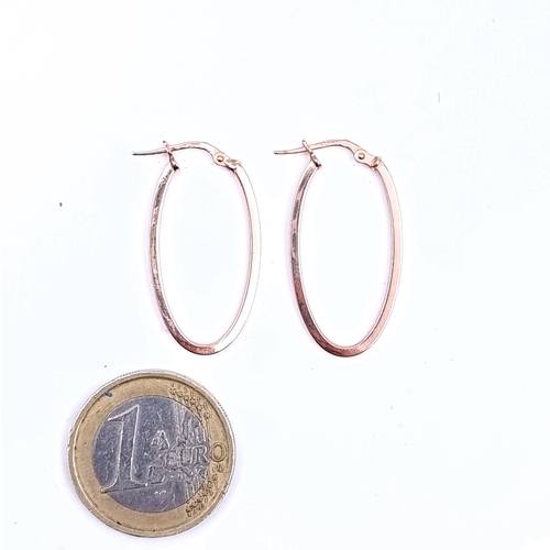 54 - A pair of hallmarked 9 carat gold hooped earrings suitable for pierced ears. Total weight 1 gram.