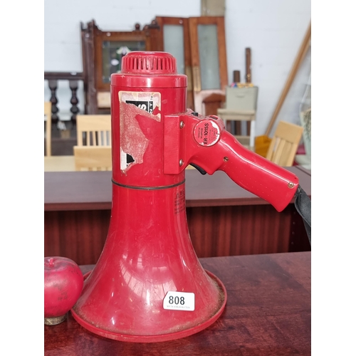 808 - A TOA transistor megaphone model number ER-1015s with siren feature and adjustable volume.