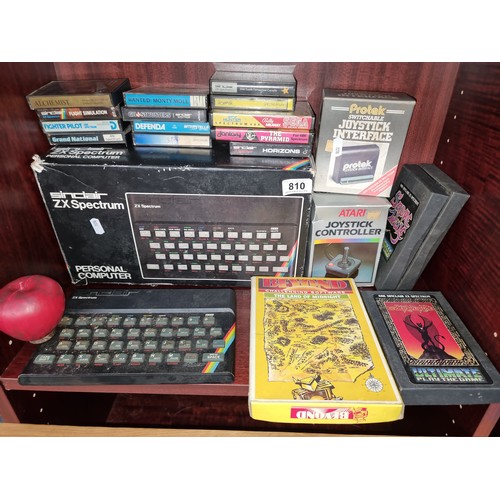 810 - A selection of vintage video game related items including an Atari joystick controller and a Sinclai... 