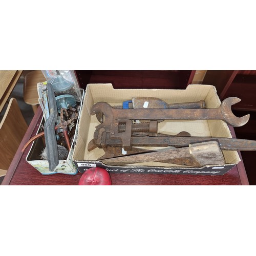 809 - A large selection of vintage tools including clamps, spanners and a set square.