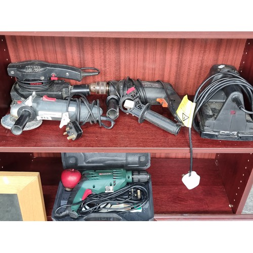 813 - A selection of four power tools items including a Black and Decker drill and a sander.