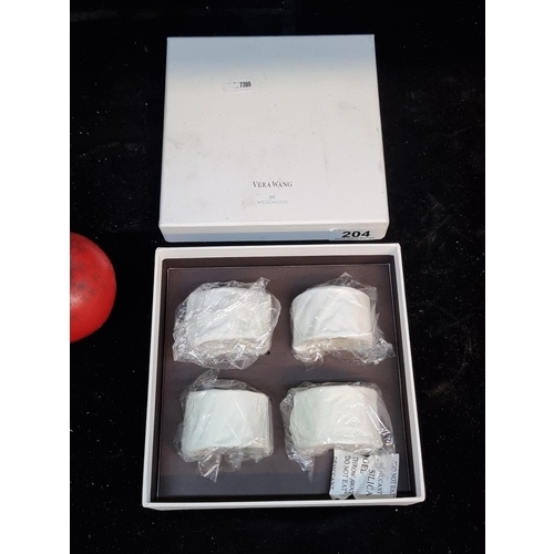 204 - An elegant set of four Vera Wang Wedgwood napkin rings with original presentation box. With internet... 